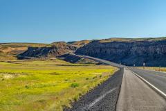 Highway 2 in Washingiton state leading along the canyon floor of Moses Coulee and uphill in the Channeled Scablands along the Ice Age Floods National Geologic Trail