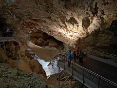 A view of a portion of the cavernous Target Room, with viewing platforms and stairs leading to other parts of the cave in Jewel Cave National Monument.
