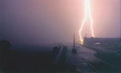 Two lightning strikes over rain-blanketed wharfs at the Salem Maritime National Historic Site