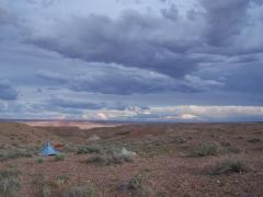 Tents set up in the backcountry of Wupatki National Monument on a cloudy overcast day