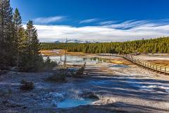 A wide-angle view of the landscape seen from the boardwalk through Porcelain Basin in Yellowstone National Park, Wyoming