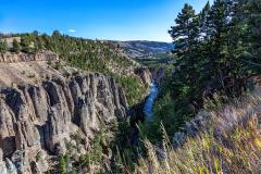 The leading line of the Yellowstone River as it flows far beneath steep igneous canyon walls, Yellowstone National Park