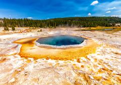 A summer view of Crested Pool at Upper Geyser Basin in Yellowstone National Park, in Wyoming